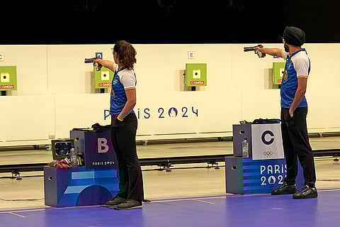 Manu Bhaker and Sarabjot Singh compete in 10m air pistol mixed team event